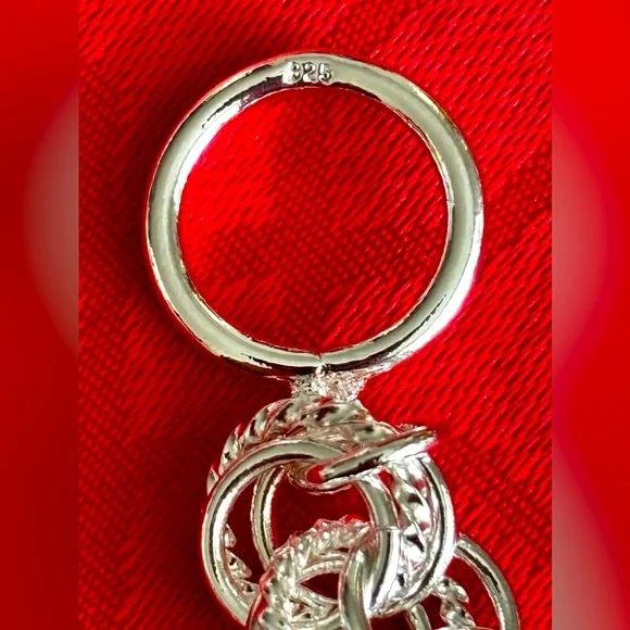 NEW 925 STERLING SILVER INTERWOVEN CIRCLES
BRACELET WITH TOGGLE CLASP  … - Picture 6 of 7